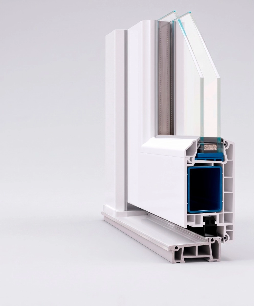 Cross-section of a white uPVC front door showing the 2 3/4 inch (70 mm) multi-chamber profile, internal steel reinforcement, double-glazed insulated glass, and weather seals | United Porte